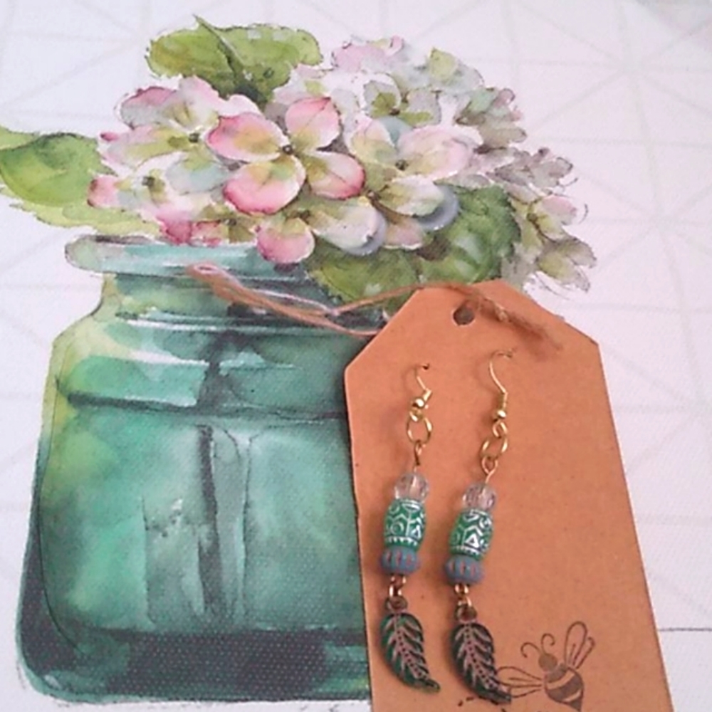 Handmade leaf with turquoise colored bead earrings. Free mask with purchase.
